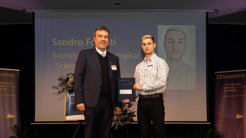 Christo van Niekerk, General Manager of Loy Yang with 2022 AGL Jungarra Wannik Scholarship recipient, Alessandro Fossati