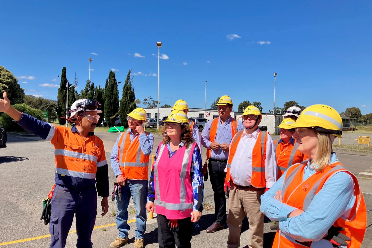 Community members touring the Bayswater Power Station in safety gear.
