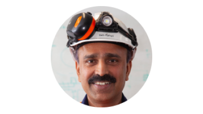 Profile photo of Seth Pathiyil wearing a hard hat and smiling.