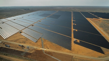 Birds-eye view of a substantial solar farm on a sunny day