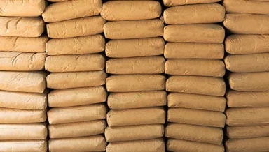 A close up of filled paper sacks in large stacks 