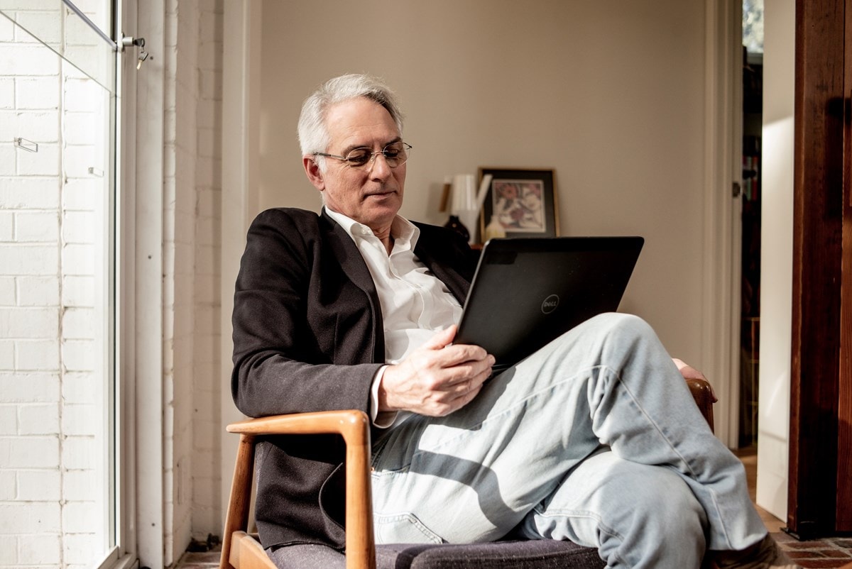 A man reading on his laptop