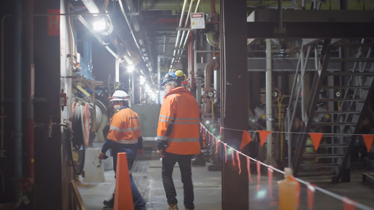 People in high vis walking at the Torrens Island Power Station