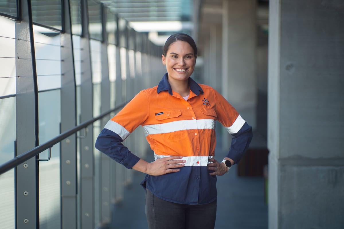 Portrait photo of Nat Saunders in high-vis at AGL offices