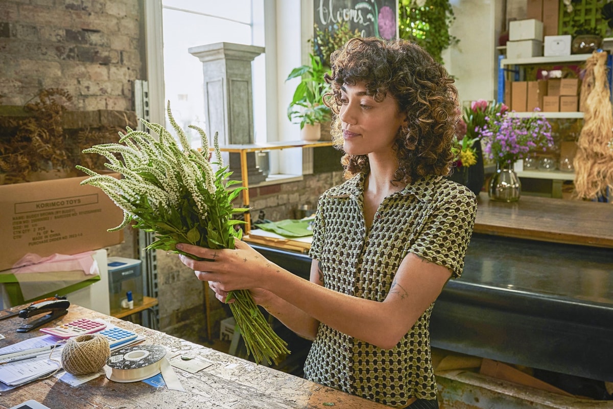 A florist looking at flowers