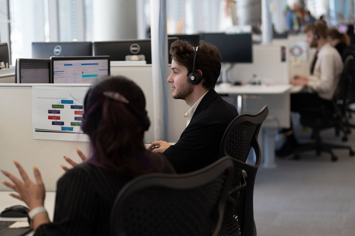 AGL staff at their desks in the offic