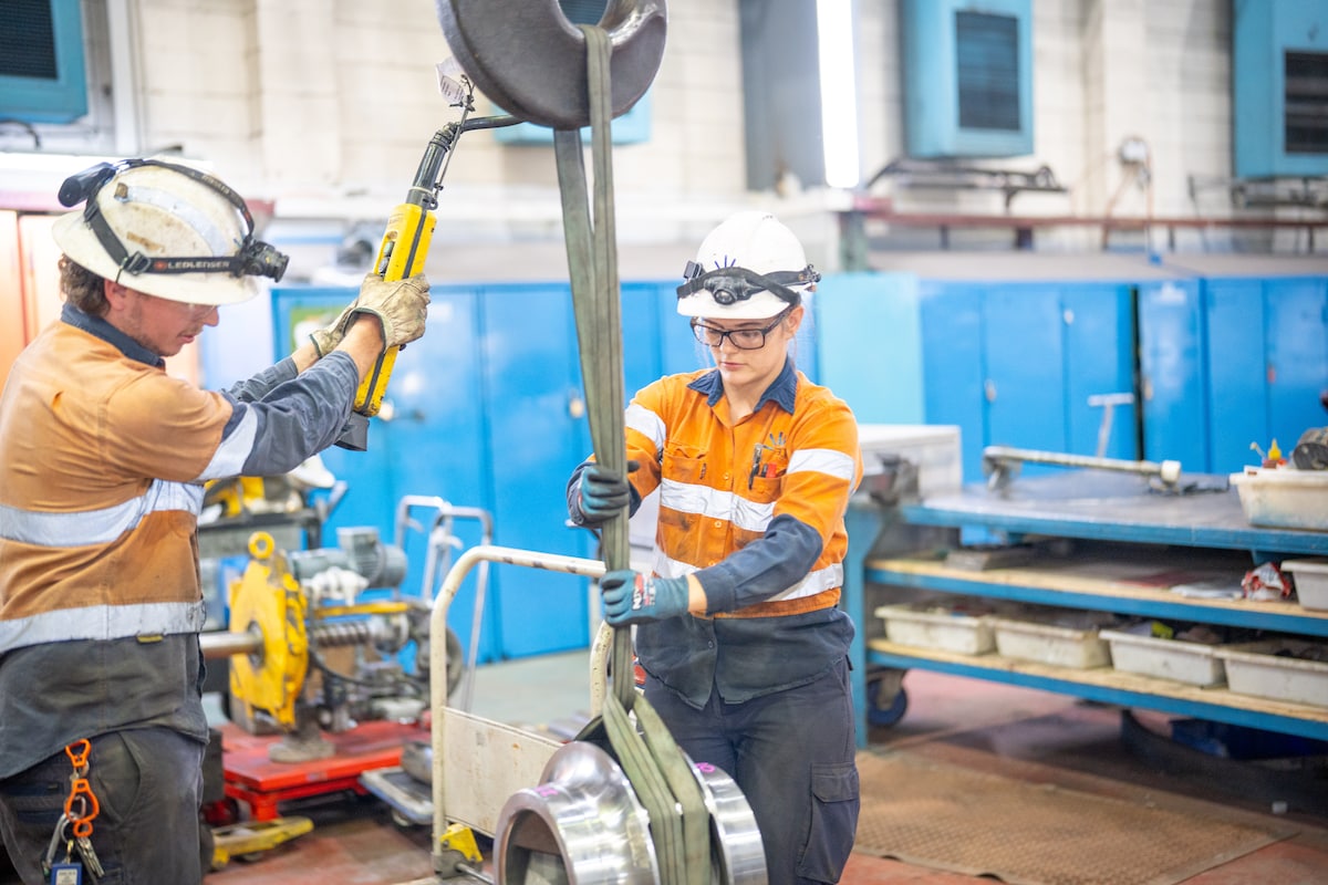 Photo of AGL employees with machinery