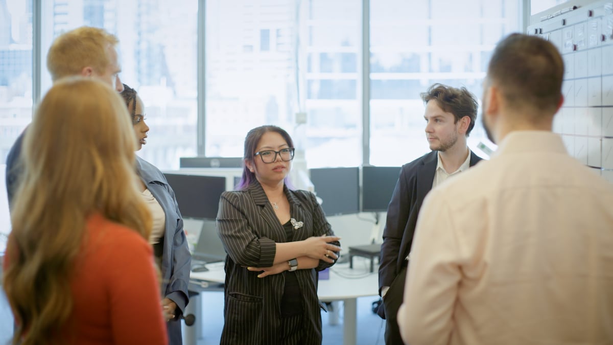 AGL team members having a chat in the office