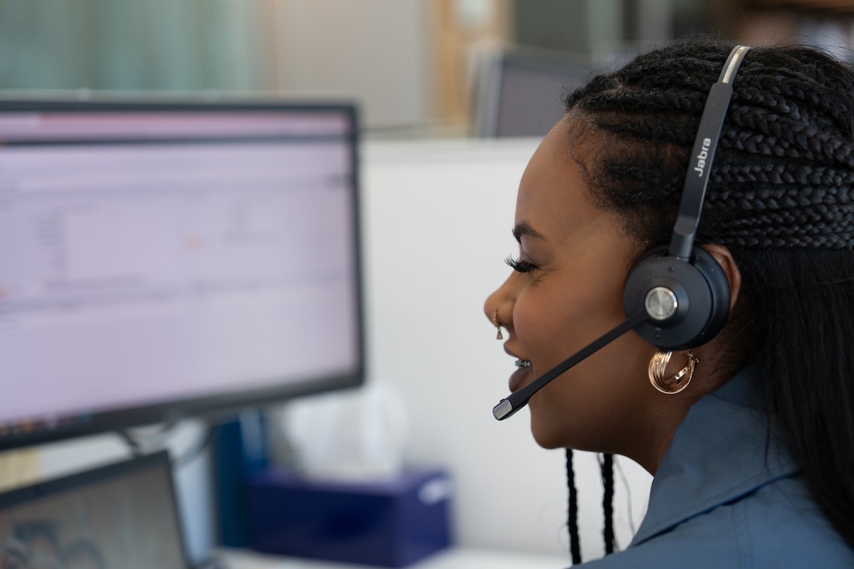 A customer solutions team member working at her desk