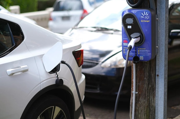 An EV plugged into a public charger