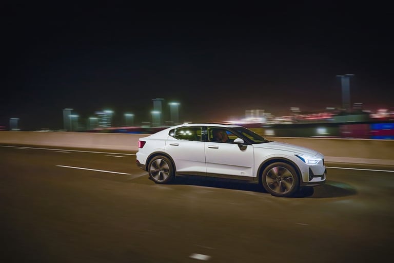 EV driving through a city at night
