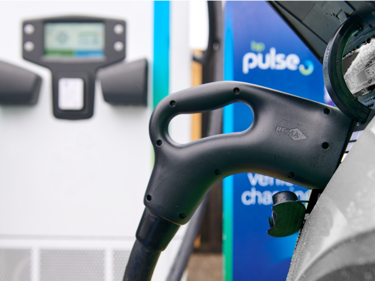 An electric car charging at a BP pulse station