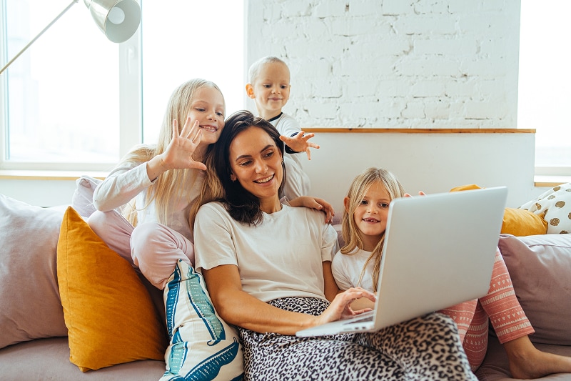 Family having fun looking at a laptop