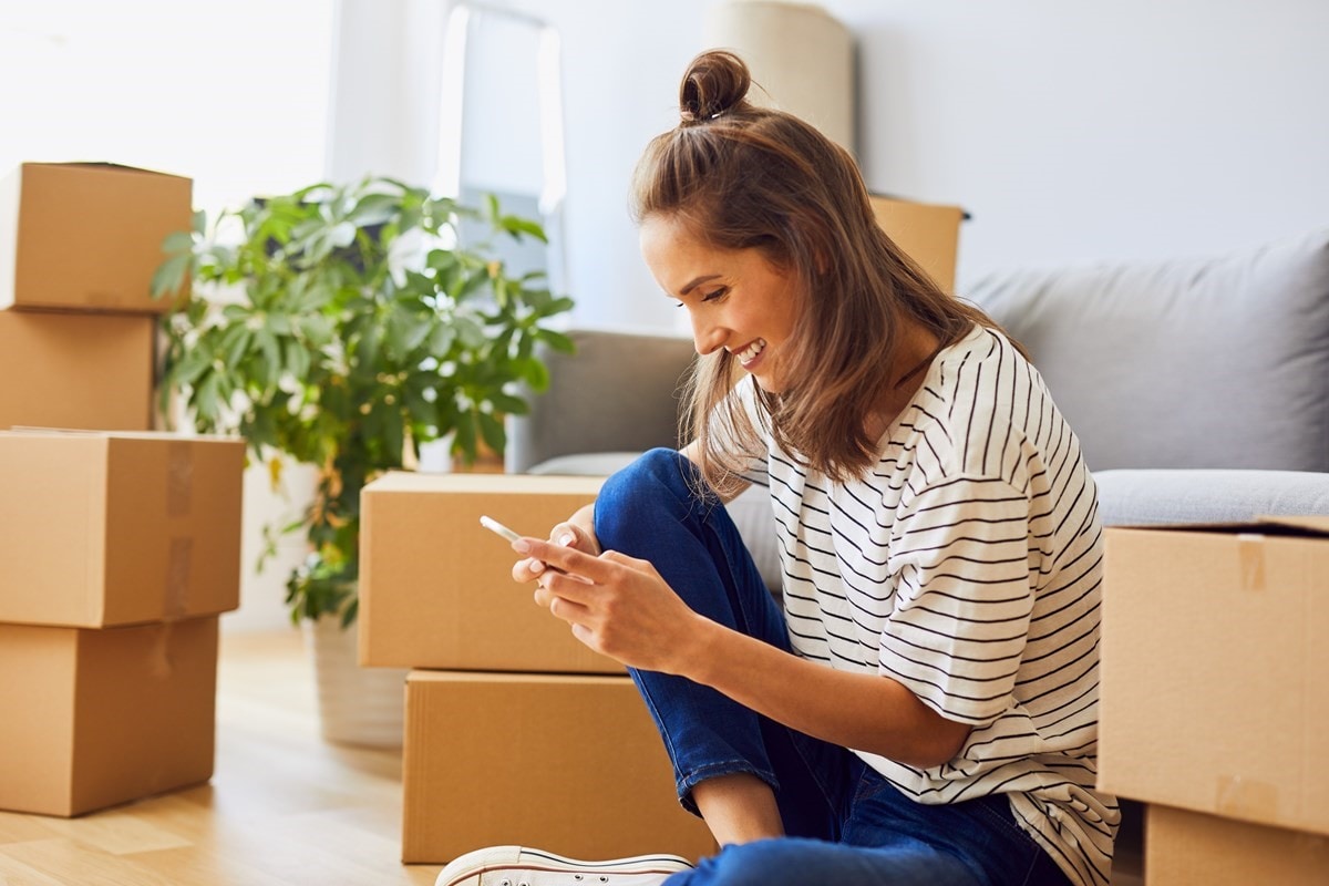 Woman on the floor with moving boxes