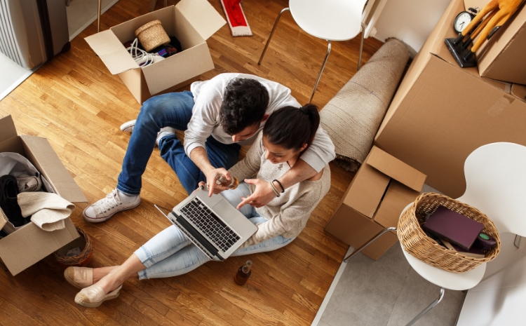 agl_s_image_birdseye-living-couple-moving-laptop