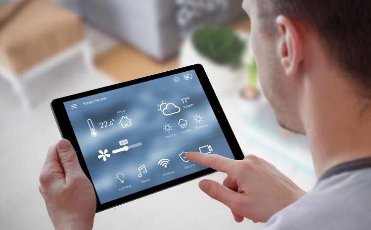Close up of tablet being used to manage a smart home