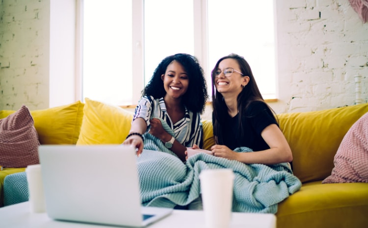 Young woman renters streaming on their couch