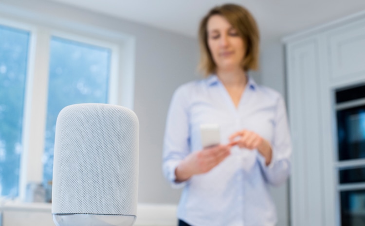 Woman using a smart speaker