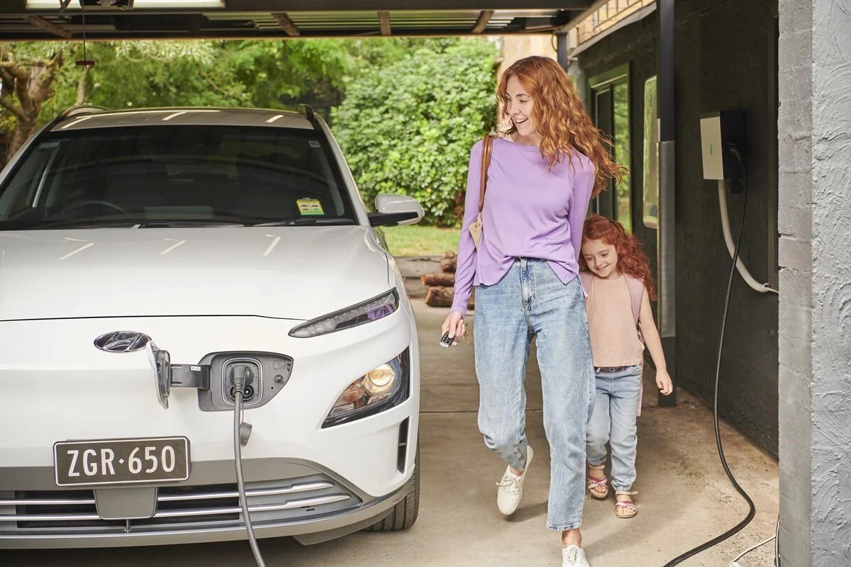 An EV charger plugged into an electric vehicle