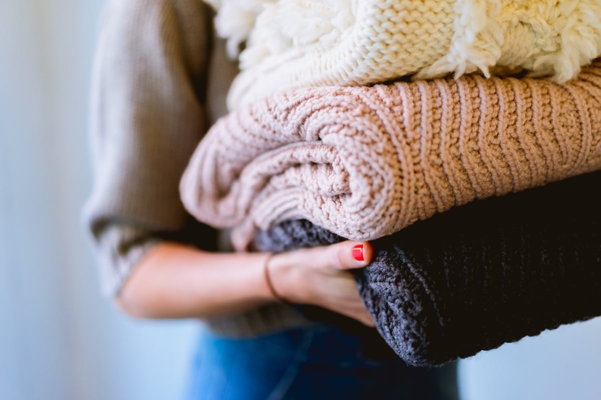 Close up of woman carrying scarves
