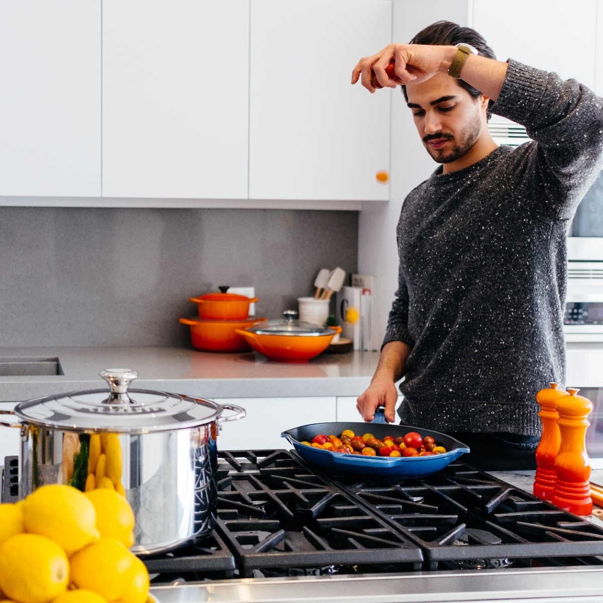 Man cooking on gas stove