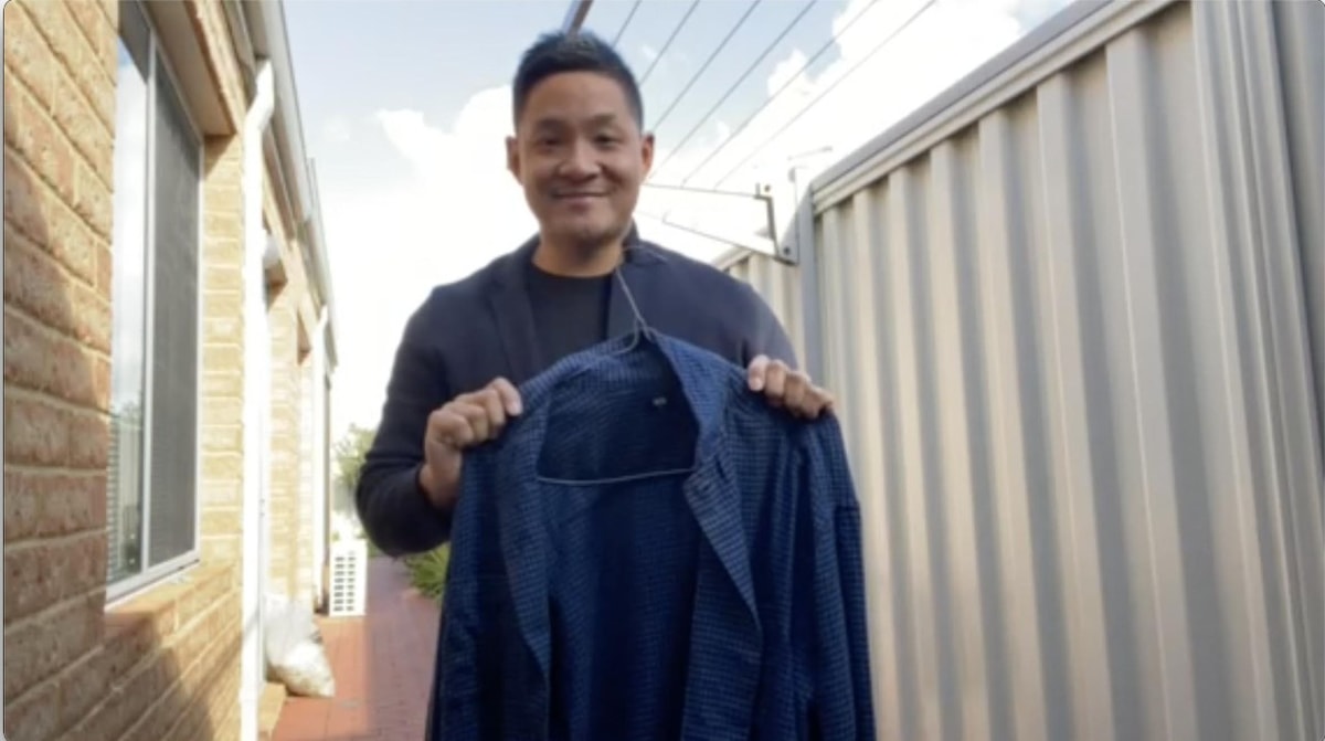 Joshua showcasing how he hangs his shirt straight after a wash