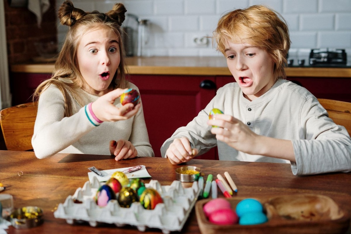 Two kids having fun with easter craft