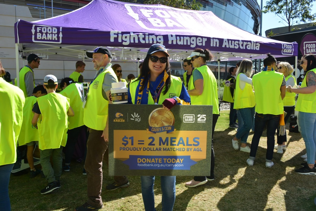 Foodbank WA volunteers at an Eagles game