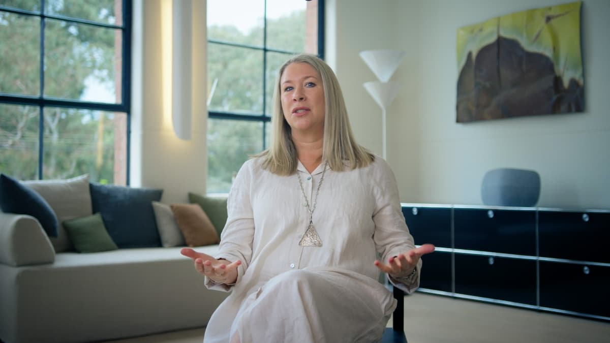 Yume founder sitting down facing camera being interviewed in office