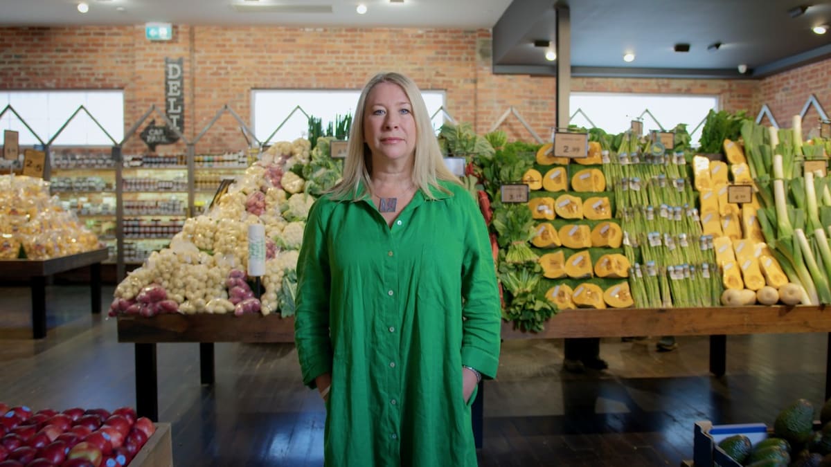 Yume CEO and founder standing in front of fresh produce in store