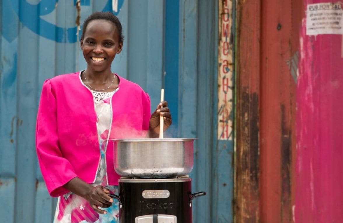 Woman stirring a hot hot from Burn Jikokoa Stove Project in Kenya
