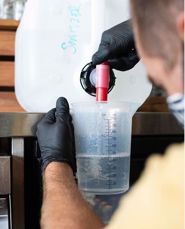 Pouring gin at Noosa Heads Distillery 
