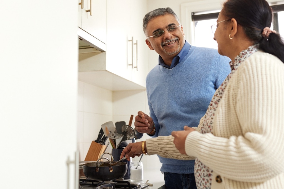 Kartik and wife in kitchen cooking together
