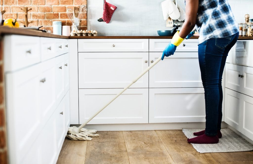 Person mopping the kitchen floor