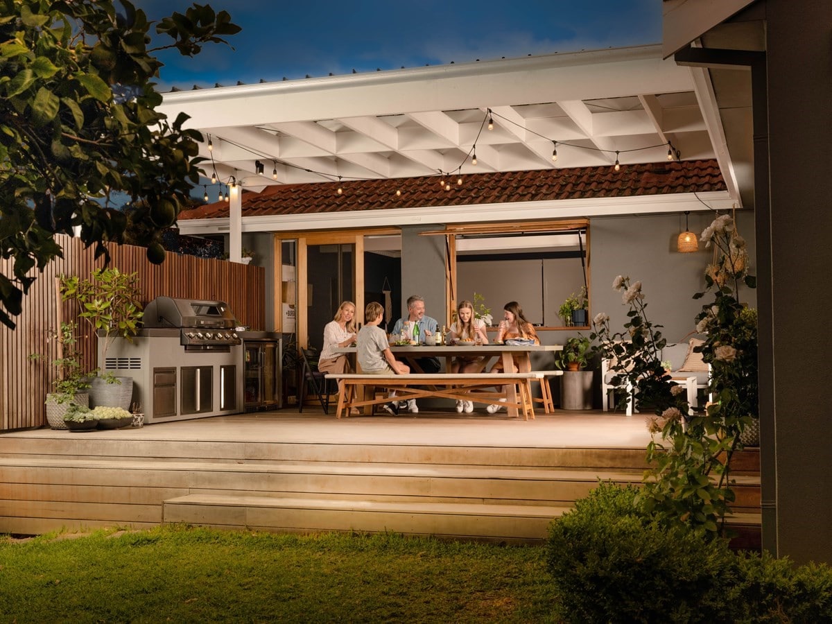 Family having a BBQ on their deck