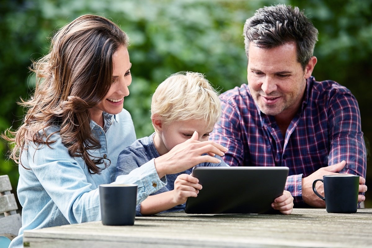 Young family playing on iPad