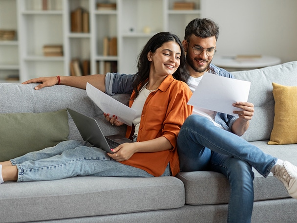 A man and woman on a couch.