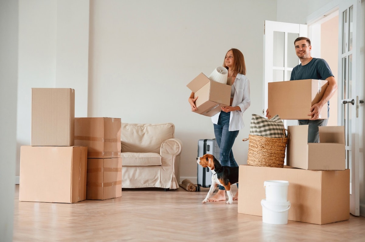 A couple unpacking boxes in their new home