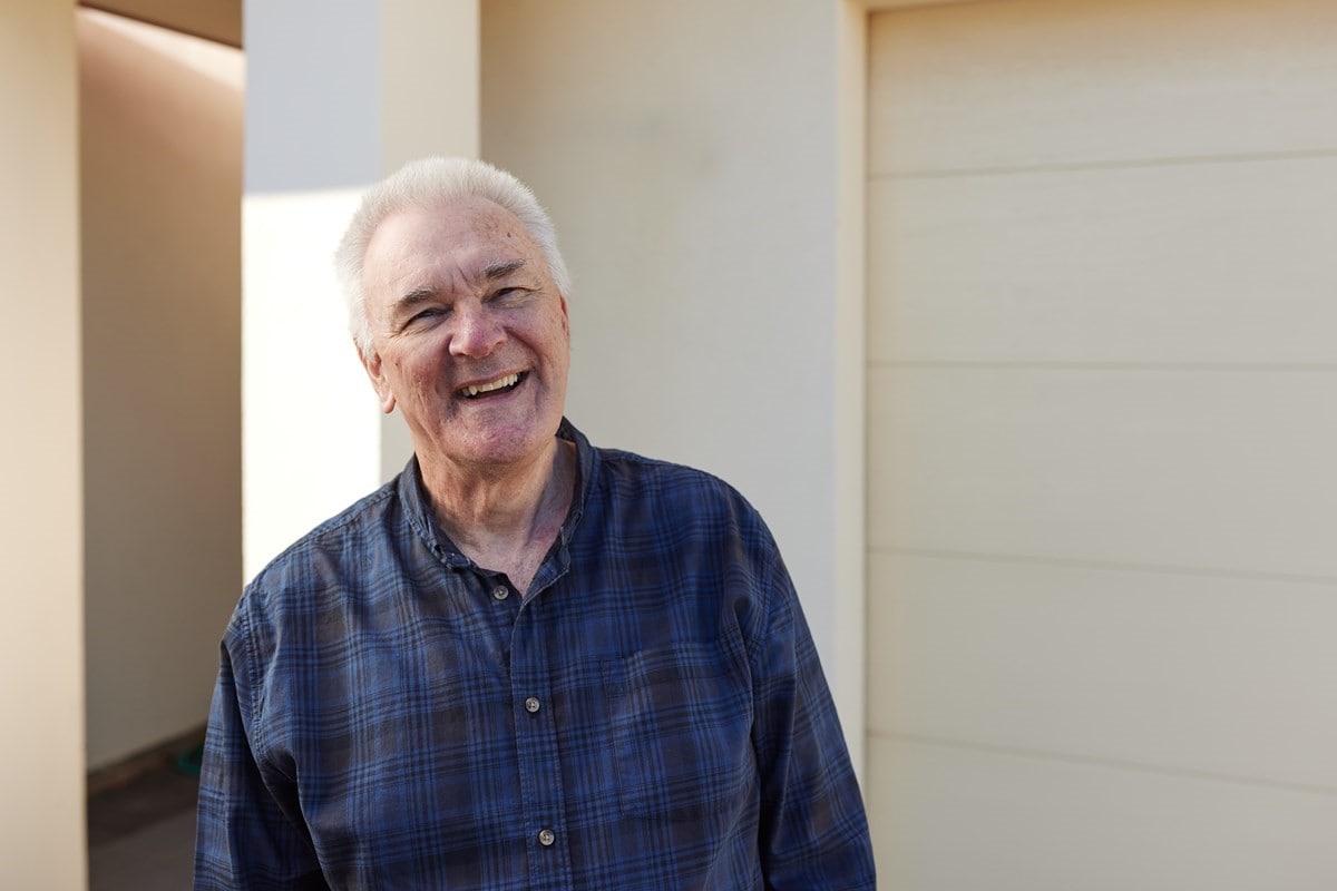 AGL customer Geoff infront of his house