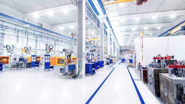 Wide shot of a well lit factory floor